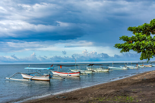 Traditional Balinese jukungs anchored on beach, Lovina, Bali, Indonesia