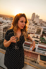 Fototapeta na wymiar Young woman drinking wine in Madrid