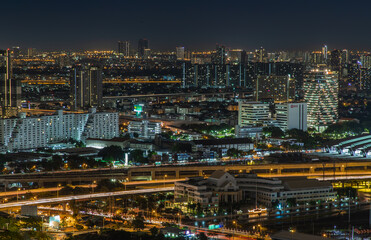Fototapeta premium Bangkok, thailand - Aug 28, 2020 : Aerial view of Bang Sue central station with skyscrapers background at night. Selective focus.