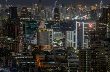 Fototapeta na wymiar Bangkok, thailand - Aug 28, 2020 : Bangkok downtown cityscape with skyscrapers at night give the city a modern style. Selective focus.