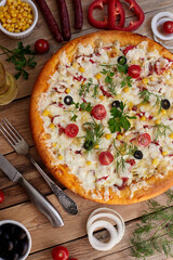 Traditional pizza pepperoni, assorted sausage, olives, arugula, corn, mozzarella