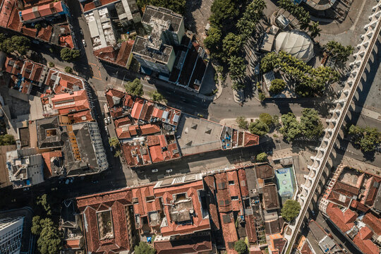 Aerial Top Down View Of The Lapa Aqueduct Arches And Historical Buildings Surrounded By Tropical Palm Trees In Rio De Janeiro, Brazil