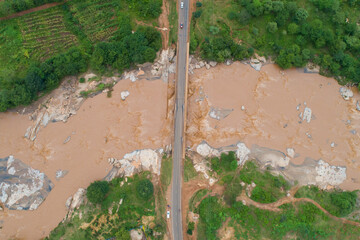 Aerial view of Kaiti River flowing past the Machakos-Wote Road in Makueni, Kenya. It drains into the Athi River which changes name to Galana then Sabaki before it drains into the Indian Ocean.