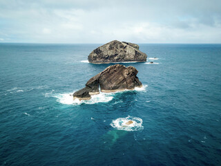 Aerial view of Ilh√©us dos Mosteiros, small rocky islands which are the remains of volcanic lava domes exposed by erosion on the west coast of S√£o Miguel Island, Azores, Portugal.