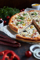 Traditional pizza pepperoni, assorted sausage, olives, arugula, corn, mozzarella