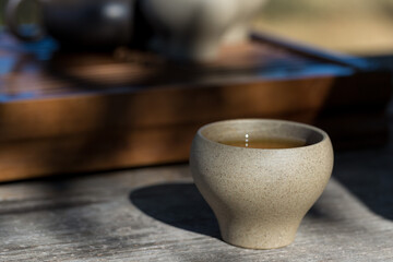 Ceramic bowls made of clay on a wooden background.