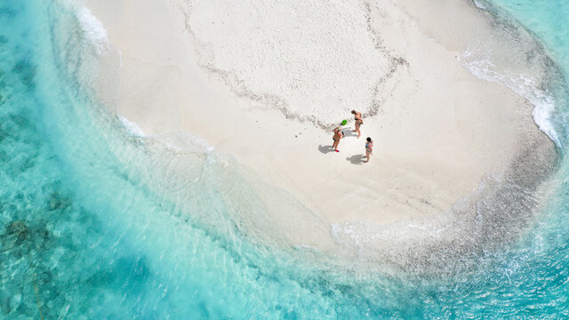 Aerial view of a sandbank, North Mal&radic;&copy; Atoll, Maldives, Indian Ocean with  people sunbathing