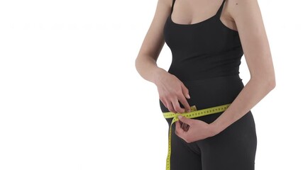 Upper body of pregnant Caucasian woman measuring her belly size with tape measure. Health care concept. Isolated on white background. - Powered by Adobe