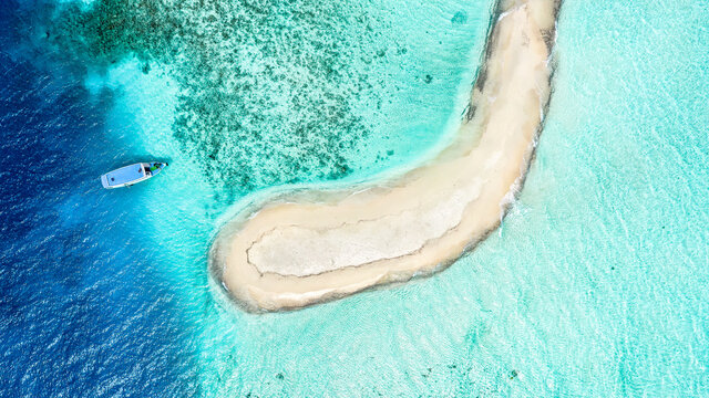 Aerial view of a sandbank, North Mal&radic;&copy; Atoll, Maldives, Indian Ocean with an anchored dhoni, boat
