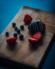 lemon pie strawberries and blueberries in table