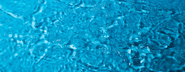 splash of water on a blue background. Abstract wallpaper