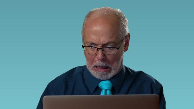 Funny businessman at computer feels rage and anger furious at his computer and yells with smoke coming out of his ears. Humorous concept of angry businessman.