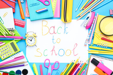 Text Back to School with different school supplies on blue background