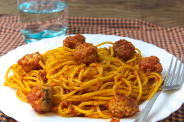 Closeup of a plate of spaghetti with meat dumplings