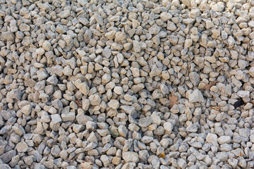 dirty gray rubble of different sizes and shapes in daylight