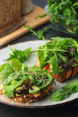 Sandwiches with salmon, avocado and salad