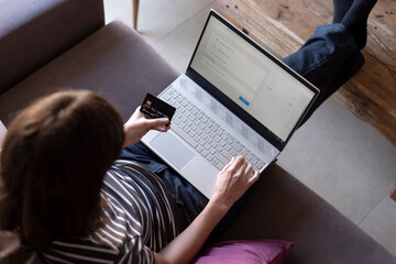 woman online shopping using laptop