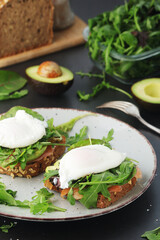 Homemade sandwiches with avocado and poached eggs