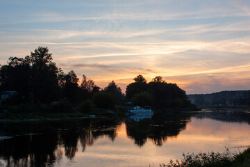 Grodno. Belarus. Evening landscape. Sunset over the Neman River, a very beautiful orange with blue sky and its reflection in the river.