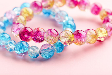 Beautiful bracelets on pink background