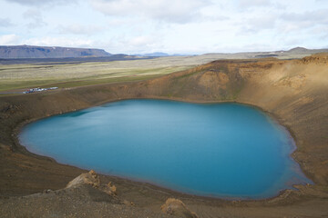 Emerald blue colored water of circular lake in Crater Víti (hell) at Krafla volcanic area, Mývatn region, Northeastern Iceland, Scandinavia