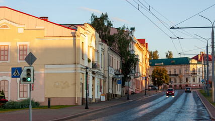 Fototapeta na wymiar Grodno, Belarus, August 25, 2020: Street of the old city against the background of the evening sky.