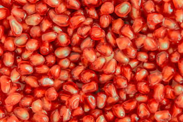 Background of fresh pomegranate seeds. Close-up.