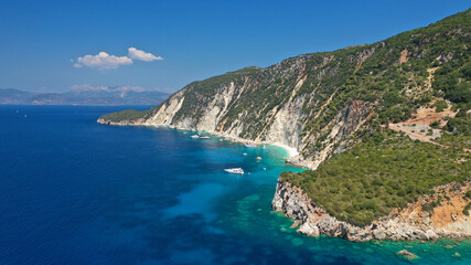 Aerial photo taken by drone of Caribbean tropical exotic steep cliff island bay with turquoise...