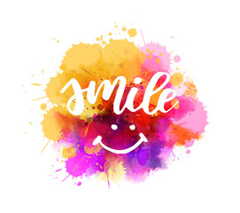 Smile - handwritten modern calligraphy lettering on colorful watercolor splash. Happy concept