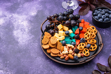 Halloween appetizers. Cheese plate with snacks