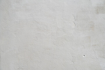 White or gray concrete wall is a decorative or textured surface. Can be used as a background or for design purposes