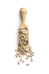Peeled sunflower seeds in wooden scoop