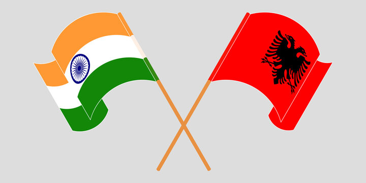 Crossed and waving flags of Albania and India