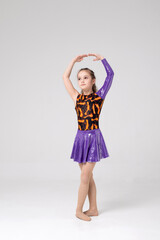 girl athlete in a stand preparing for choreography