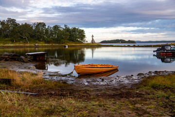 landscape of the island against the background of old wooden boats lying on the shore