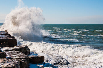 waves crashing on rocks