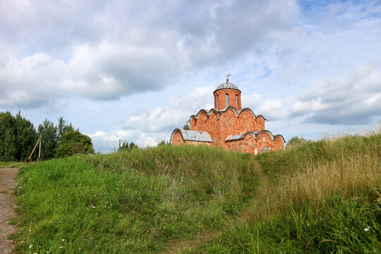 Beautiful medieval church of the Savior on Kovalevo with red walls near Velikiy (Great) Novgorod, Russia