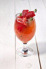 summer cocktail with fresh berries and fruits