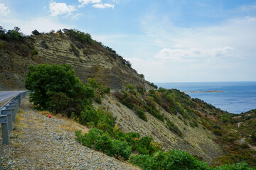 beautiful view from the mountain road to the mountains, gorge, sea, beautiful sky and island in the sea