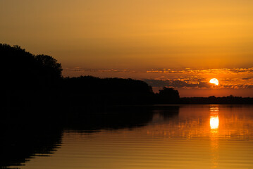Fototapeta premium Beautiful sunrise over the river, lake.