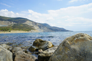 beautiful landscape - sea, mountains, beautiful sky on a warm summer day
