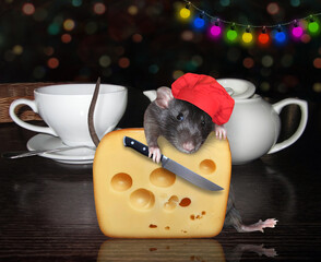 A black rat in a red chef hat with a knife is cutting a big piece of cheese with holes near tea cups on a table.