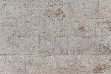 abstract background of an ancient plastered stone lined wall