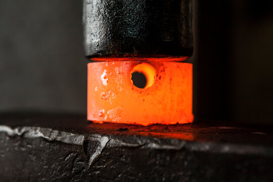 Hot metal between hammer and anvil
