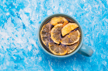 Mug with tea and lemon slices