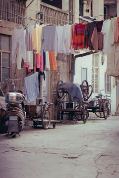 Laundry hangs over the back ally street in Shanghai, China
