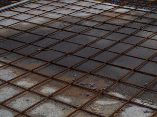 Abstract background of iron armature ready for concreting Metal armature in reinforced concrete structures close-up
