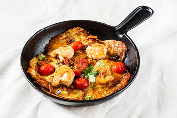 potato pancakes with shrimps and tomatoes