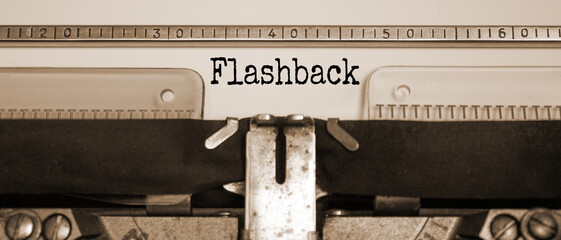 Word 'flashback' typed on retro typewriter. Sepia effect. Business concept.