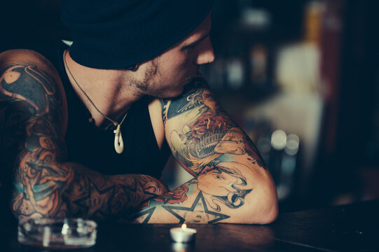 Man with mexican tattoo in pub